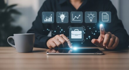 Poster - Person using a tablet with digital icons above it and a coffee mug on a wooden table near them