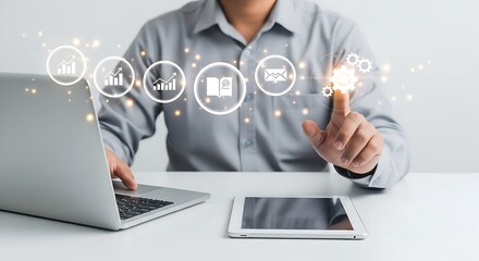 Fototapete - Man interacting with digital icons over laptop and tablet on a white desk in a bright office space
