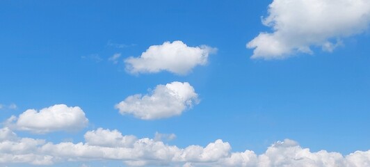 Wall Mural - Sky panorama clear blue with white clouds in spring. Cloudscape