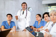 © JackF - Medical director holds a meeting with colleagues in the office of the clinic
