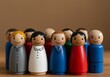 © Sadaqat - A close-up view of a diverse group of hand-painted wooden peg dolls with cheerful facial expressions, representing a colorful community of people standing closely together, showcasing unity, inclusion