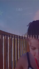Poster - Animation of digital data processing and glowing lights over caucasian girl on the beach