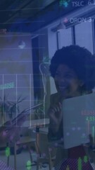 Poster - Animation of graphs, trading boards, map over diverse coworkers discussing reports on laptop