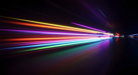 Fototapete - Abstract image of colorful light streaks in motion against a dark background, creating a sense of speed and energy.