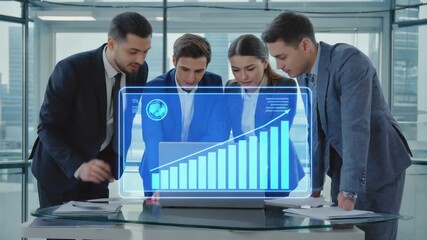Poster - Four business professionals collaborating on a project, analyzing holographic financial data on a laptop in a modern office, leveraging cutting-edge technology for strategic decisions