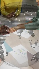 Poster - Diverse team collaborating at table with digital globe animation overlay
