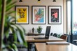 © Muhammad Saad - Laptop on desk in bright office space with framed art, creating a modern and creative workplace environment for productivity