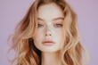 © ALPADESIGN - Close-up of a young woman with beautiful, healthy-looking skin and wavy hair.
