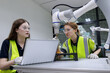 © gumpapa - automation machine engineer woman students study and inspection control robot arm machine in robotics engineering academy at university or factory workshop. AI robot technology,