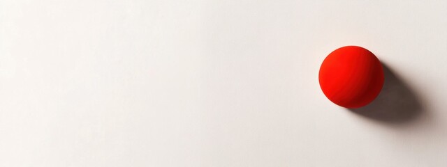 Poster - Single Red Ball on a Clean White Surface in Minimalist Style