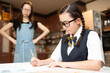 © hakase420 - 自宅で勉強をする中学生と見守る母親