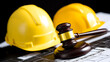 © photo for everything - Construction law: A gavel rests atop architectural blueprints, symbolizing legal aspects of building and development, with hard hats in the backdrop.