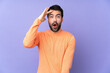 © luismolinero - Caucasian handsome man over isolated purple background has just realized something and has intending the solution