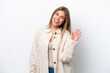 © luismolinero - Young caucasian woman isolated on white bakcground saluting with hand with happy expression