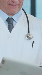 Poster - Animation of happy earth day text over diverse doctors