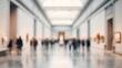 © Blur Bokeh - Spacious museum hall featuring large sculptures and visitors admiring them, blurred image, soft out-of-focus background