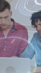 Poster - Two men collaborating on laptop with digital interface animation overlay