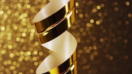 Golden spiral ribbon against bokeh background
