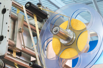 Aufkleber - Fragment of the conveyor of sticking labeling machine. Abstract industrial background.