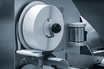 Aufkleber - Fragment of the conveyor of sticking labeling machine. Abstract industrial background
