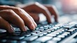 © Dualas - Close-up hands typing on keyboard