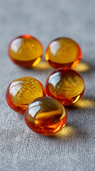 Wall Mural - Four Amber Glass Spheres on Gray Fabric