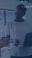 Poster - Animation of graphs and trading board over diverse colleague discussing over laptop in office