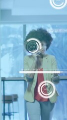 Poster - Animation of data processing against two african american women discussing in office corridor