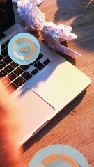 Poster - Animation of graph icons, overhead view of man working on laptop and writing in notepad