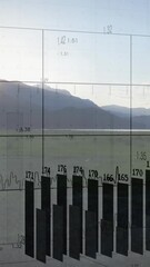 Poster - Animation of bar chart and data overlaying serene mountain landscape at sunrise