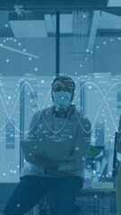 Poster - In office, diverse team collaborating with data animation overlay wearing masks