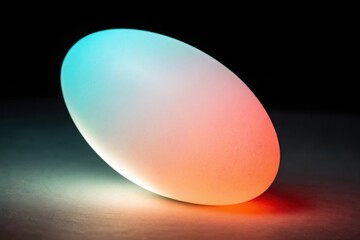 Poster - Glowing oval lamp with gradient colors on a dark surface