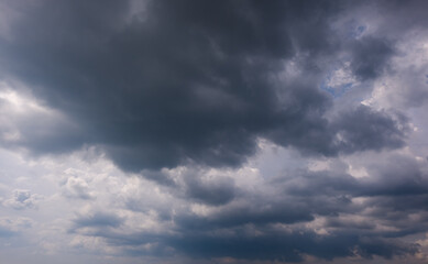 Wall Mural - dark sky with stormy clouds. dramatic sky rain,dark clouds before a thunder-storm,clouds before rain