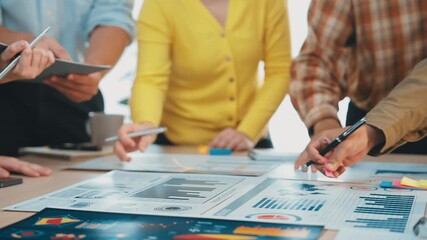 Poster - A dynamic team collaborates in a modern office environment, engaging in a business strategy presentation while exploring ideas on documents and laptops for future projects. SACTR