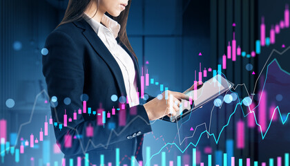 Poster - Businesswoman analyzing financial graphs on tablet with digital stock market data overlay in a corporate office at night conceptually displayed.