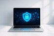© Pixels Hunter - Cybersecurity shield icon glowing on laptop screen with hexagonal tech graphics on dark interface, on white desk with shadowed light background.