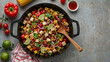 © janzwolinski - Vegan mexican salad with roasted tofu, corn and beans in a black pan