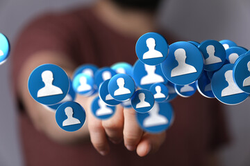 Poster - Hand interacting with floating social media profile icons.  Networking, connection, community.
