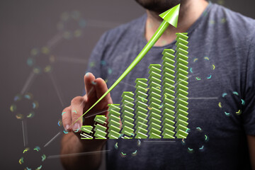 Poster - Stock photo of a person interacting with a digital growth chart, symbolizing financial success and upward trend.