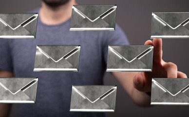 Poster - Stock photo of a man digitally interacting with multiple email envelopes. Perfect for illustrating email management, communication, or inbox overload.