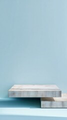 Fototapete - Minimalist light blue interior featuring wooden shelves, providing clean backdrop for displaying products or decor elements with serene ambiance