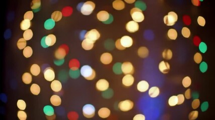 Poster - Blurred lights with blue, green, red, and golden hues create a festive, out-of-focus bokeh effect on a dark background