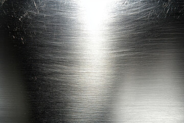 Fototapete - Macro view of brushed metal texture with light reflection. Abstract background for industrial design. Grey colored smooth metallic surface concept.
