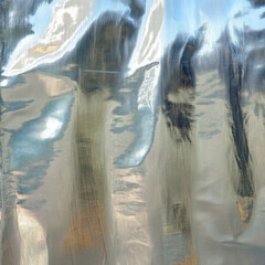 Poster - Abstract wrinkled foil texture background with metallic silver color and reflections. Crumpled holographic shiny surface for contemporary design.