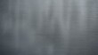 © Lasvu - A smooth, metallic surface with a brushed texture and a grayish-silver color.