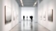© Blur Bokeh - White gallery space with abstract artworks on display and visitors walking through. blurred image, soft out-of-focus background