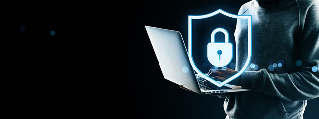 Fototapete - Cybersecurity concept showing user with laptop and glowing padlock shield icon symbolizing secure data, privacy protection, and digital safety.