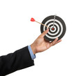 © Robert - Isolated Photo Businessman Holding Dartboard Bullseye