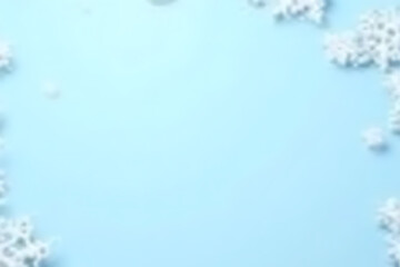 Aufkleber - Light blue background with white snowflake shapes arranged around the edges creating a wintery border with copy space