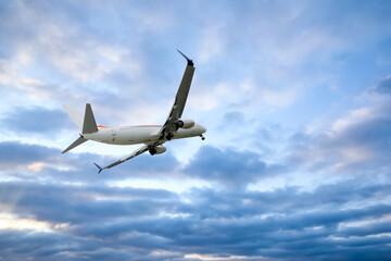 Wall Mural - airplane flying in beautiful blue sky with clouds